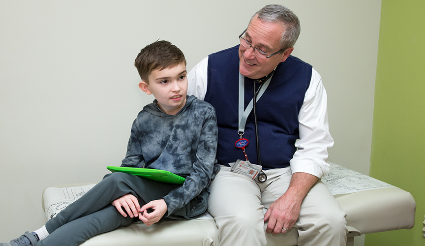 Dr. John Bissler with a Le Bonheur Children's Hospital patient in the neuro clinic